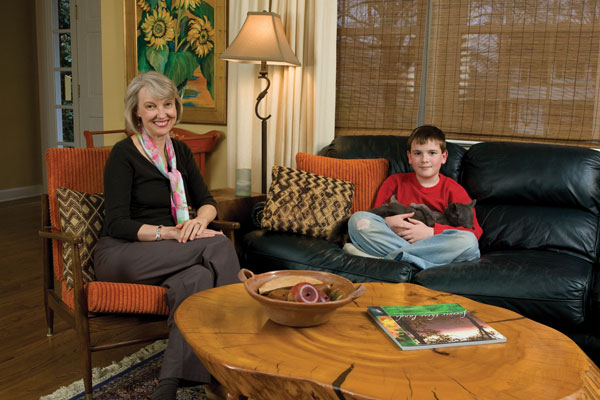 
Wanda and her 11-year-old son, Henry, holding Whiskers the cat.
